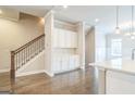 View of a staircase and built-in cabinets offering ample storage with modern finishes creating a stylish focal point at 1106 Bakary Ct, Decatur, GA 30032