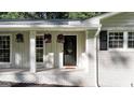 Close up of the covered front porch with hanging floral baskets at 4353 White Oak Dr, Sugar Hill, GA 30518