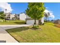 Beautiful two-story home with a two car garage, set on a well-manicured lawn at 1003 Nandina Ct, Villa Rica, GA 30180