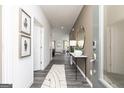 Welcoming entryway showcasing modern decor, hardwood floors, and a view into the living space at 502 Regency Trl, Acworth, GA 30102
