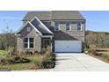 Attractive two-story brick home featuring a two-car garage and well-maintained landscaping at 502 Regency Trl, Acworth, GA 30102