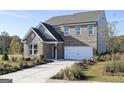 Beautiful two-story brick home with a two-car garage and professionally landscaped front yard at 502 Regency Trl, Acworth, GA 30102