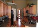 Well-equipped kitchen featuring granite countertops, stainless steel appliances, and ample cabinet space at 141 Windward Hills, Mcdonough, GA 30253