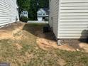This side yard features an air conditioning unit at 9515 Lakeview Rd, Union City, GA 30291