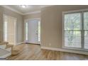 Inviting entryway with updated flooring and natural light, showcasing the home's welcoming ambiance at 1201 Justin Ln, Lithonia, GA 30058
