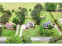Spacious properties showcasing well-maintained homes and expansive, verdant lawns, creating a serene atmosphere at 235 Surrey Park Dr, Fayetteville, GA 30215