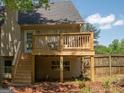 Backyard deck featuring wood railings, stairs to the yard, and outdoor seating at 11 Line Creek Cir, Sharpsburg, GA 30277