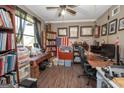 Bright office space with built-in shelving, large windows, and wooden floors at 11 Line Creek Cir, Sharpsburg, GA 30277