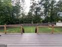 Back deck with a view of the lawn and wood fence at 1128 Carillon Se Dr, Conyers, GA 30013