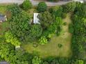 Aerial view of a home surrounded by lush trees and sprawling green lawn at 7550 Fielder Rd, Jonesboro, GA 30236