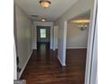Inviting entryway with gleaming hardwood floors leading into the home's living spaces at 590 Dot Dr, Atlanta, GA 30349
