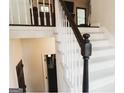 Bright staircase featuring white risers and black trim leading to the second floor living space at 228 Hunt Club Cir, Temple, GA 30179
