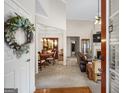 Open-concept living space with hardwood floors, fireplace, and dining area at 3206 Abbott Dr # 12, Powder Springs, GA 30127
