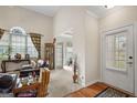 Open-concept living room featuring hardwood floors, large windows, and comfortable seating at 3206 Abbott Dr # 12, Powder Springs, GA 30127