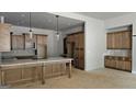 Well-lit kitchen featuring ample wood cabinetry and a spacious center island at Lot 1 Alex Stephens Rd # 1, Moreland, GA 30259