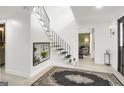 Bright foyer featuring a staircase with black iron balusters and decorative decor at 4786 Carlene Sw Way # Iv, Lilburn, GA 30047