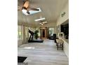 Bright sunroom with skylights, a ceiling fan, and a wooden sauna at 4786 Carlene Sw Way # Iv, Lilburn, GA 30047