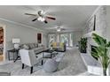 Bright living room with fireplace, neutral color scheme, and patio access at 1486 Maple Ridge Dr, Suwanee, GA 30024