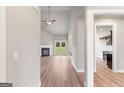 Bright living room showcasing hardwood floors, a fireplace, and access to a patio at 123 Oak Road, Locust Grove, GA 30248