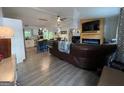 Open-concept living room featuring wood-look floors and a modern electric fireplace at 324 Bells Ferry Ne Rd, White, GA 30184