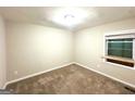 Bedroom with neutral walls, carpet flooring, and natural light from a window at 2229 Sharon Way, Decatur, GA 30032
