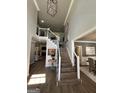 Grand foyer with a staircase and views into the living and dining rooms at 1122 Montclair Dr, Peachtree City, GA 30269