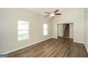 Inviting living room with beautiful flooring, ceiling fan, and large windows, perfect for relaxation and entertaining at 3587 Oakvale Ave, Decatur, GA 30034