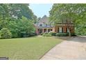 Stately two-story home with lush front lawn, landscaping, and a welcoming entrance at 102 Passage Point, Peachtree City, GA 30269