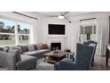 Bright living room showcasing a fireplace, modern furniture, and ample natural light at 1208 Trombone Way # 106, Mcdonough, GA 30252
