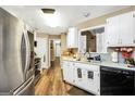 Cozy kitchen with stainless steel appliances and ample counter space at 422 Old Ivy Path, Mcdonough, GA 30253
