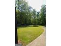 Large backyard with well-maintained green grass, perfect for outdoor activities at 1010 Forest Overlook Sw Dr, Atlanta, GA 30331