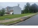 Exterior shot of the side of the home, showing the lawn and street at 7253 Lacey Dr, Douglasville, GA 30134