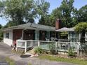 Cozy backyard deck featuring a brick house with a grill and seating area at 520 Mcdonough Rd, Hampton, GA 30228