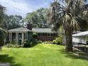 Spacious backyard with lush lawn, perfect for outdoor activities and relaxation at 520 Mcdonough Rd, Hampton, GA 30228