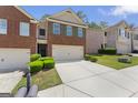 Inviting townhome with brick facade, two-car garage and lush green lawn at 2714 Haynescrest Dr, Grayson, GA 30017