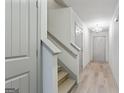 Bright hallway featuring hardwood floors, staircase and modern chandelier at 2714 Haynescrest Dr, Grayson, GA 30017