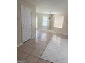 Bright living area showcasing tile floors, natural light, and seamless flow at 2517 Walter Way, Stockbridge, GA 30281