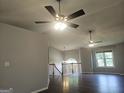 Spacious living room with hardwood floors, vaulted ceilings, and ample natural light at 54 Crestwood Dr, Dallas, GA 30157