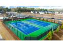 Aerial view of the community tennis courts, showcasing a recreational amenity for residents at 325 Silver Moon Dr, Loganville, GA 30052