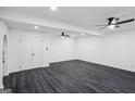 Bright, open living space with modern lighting, flooring and natural light with closet and arch entry at 5490 Chemin De Vie, Sandy Springs, GA 30342