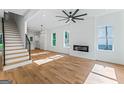 Spacious living room with a modern fireplace, lots of natural light, and hardwood floors throughout at 1835 Taylor Ave, East Point, GA 30344