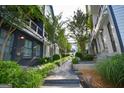 Charming walkway between homes, featuring lush landscaping, trees, and rock features, adding to the neighborhood's appeal at 756 Cady Way, Atlanta, GA 30312
