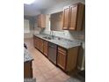 Well-lit kitchen features stainless steel appliances, ample counter space, and wooden cabinets at 2754 Vining Ridge Terrace, Decatur, GA 30034