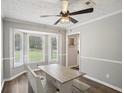Bright dining area featuring a bay window and farmhouse-style dining set at 120 Bowfin Bay, Peachtree City, GA 30269