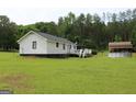 View of house with a deck, and a pool at 124 Wynn Rd, Mcdonough, GA 30252