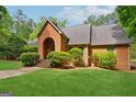 Beautiful brick house with a well-manicured lawn and mature landscaping adding to its curb appeal at 9255 Betony Wood Trl, Jonesboro, GA 30236