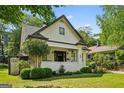 Attractive home featuring a covered porch, fresh landscaping, and neutral paint scheme with contrasting trim at 622 Seminole Ne Ave, Atlanta, GA 30307