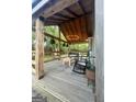 Cozy covered porch features rocking chairs, wooden details, string lights, and comfortable outdoor seating at 316 Gaithers Rd, Mansfield, GA 30055