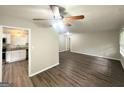 Spacious living room featuring hardwood floors, a ceiling fan, and neutral paint at 3375 Brenda Ln, Lithia Springs, GA 30122