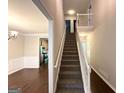A view of the home's staircase, showing the transition between floors and the layout of the home at 3814 Clear Lake Nw Way, Acworth, GA 30101